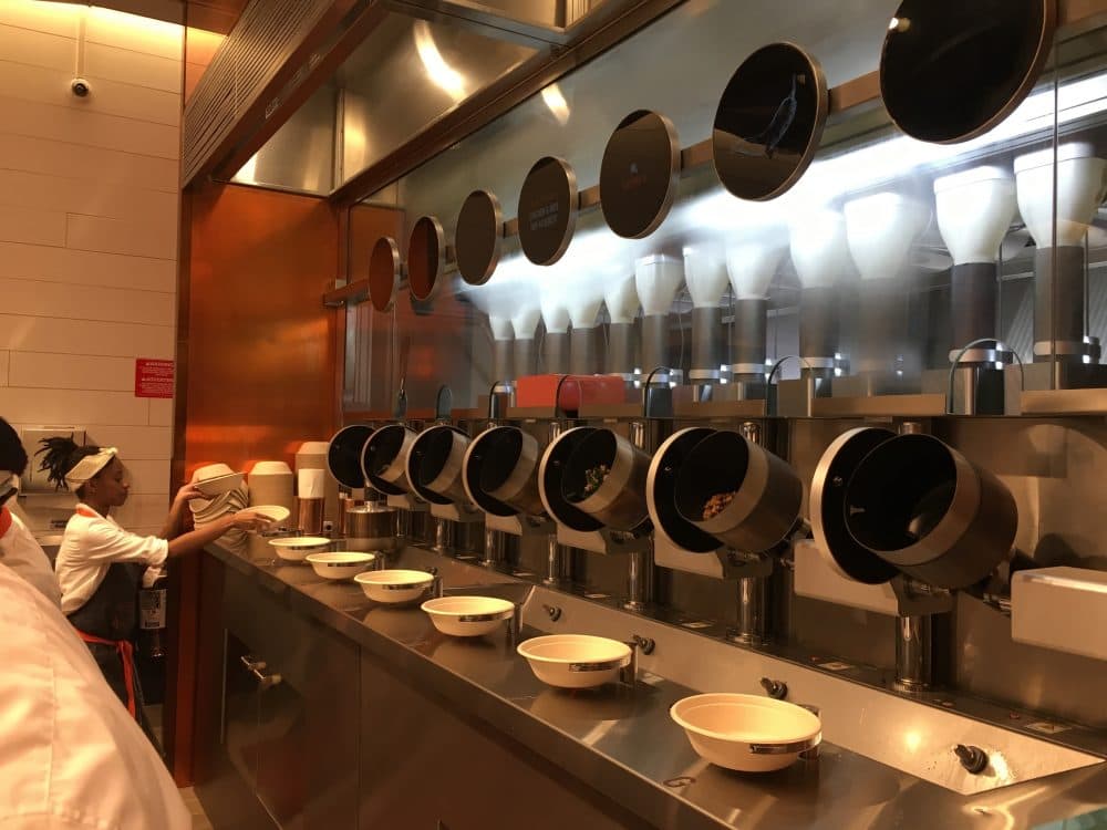 Robot machines prepare dishes at Spyce in Boston's Downtown Crossing. (Meghna Chakrabarti/WBUR)