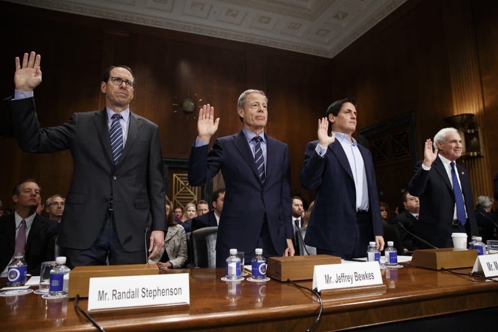 From left, AT&T Chairman and CEO Randall Stephenson, Time Warner Chairman and CEO Jeffrey Bewkes, AXS TV Chairman and Dallas Mavericks owner Mark Cuban, and Public Knowledge Chairman and CEO Gene Kimmelan are sworn in  on Capitol Hill in Washington, Wednesday, Dec. 7, 2016,, prior to testifying before a Senate Judiciary subcommittee hearing on the proposed merger between AT&amp;T and Time Warner. (AP Photo/Evan Vucci)