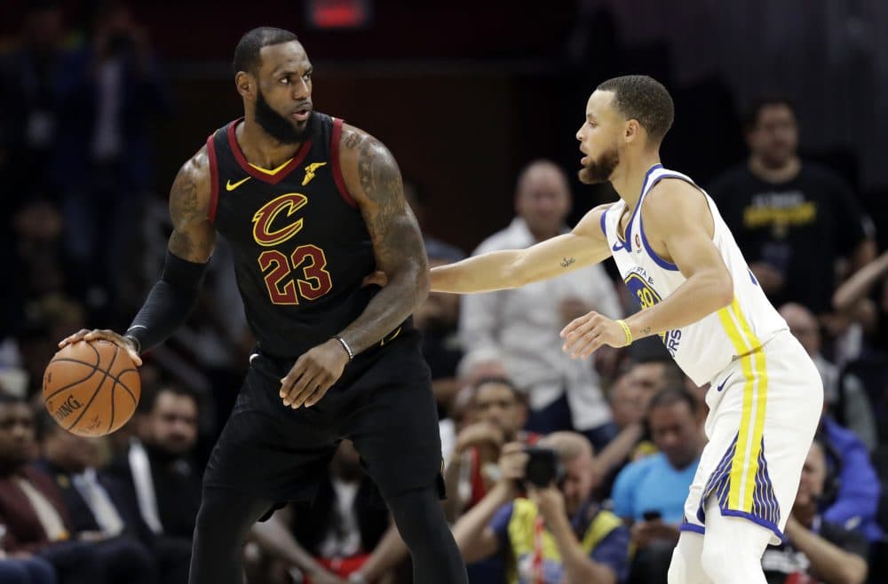 Cleveland Cavaliers' LeBron James is defended by Golden State Warriors' Stephen Curry during the first half of Game 4 of basketball's NBA Finals, Friday, June 8, 2018, in Cleveland. (Tony Dejak/AP)
