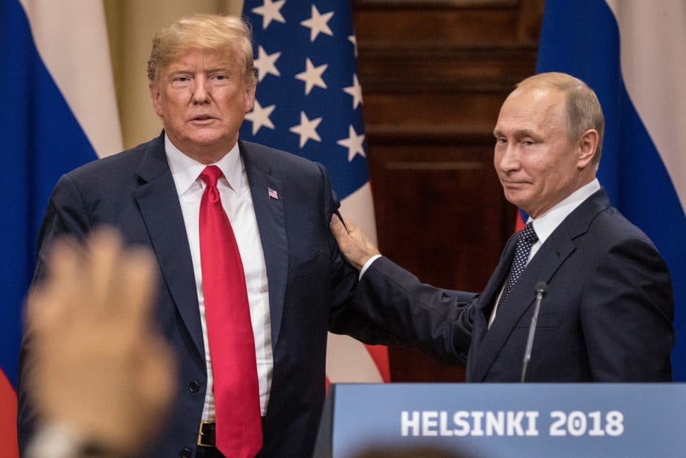 President Trump (left) and Russian President Vladimir Putin shake hands during a joint press conference after their summit on July 16, 2018 in Helsinki, Finland. (Chris McGrath/Getty Images)