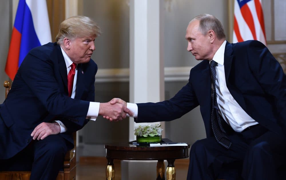 Russian President Vladimir Putin (right) and President Trump shake hands before a meeting in Helsinki, on July 16, 2018. (Brendan Smialowski/AFP/Getty Images)