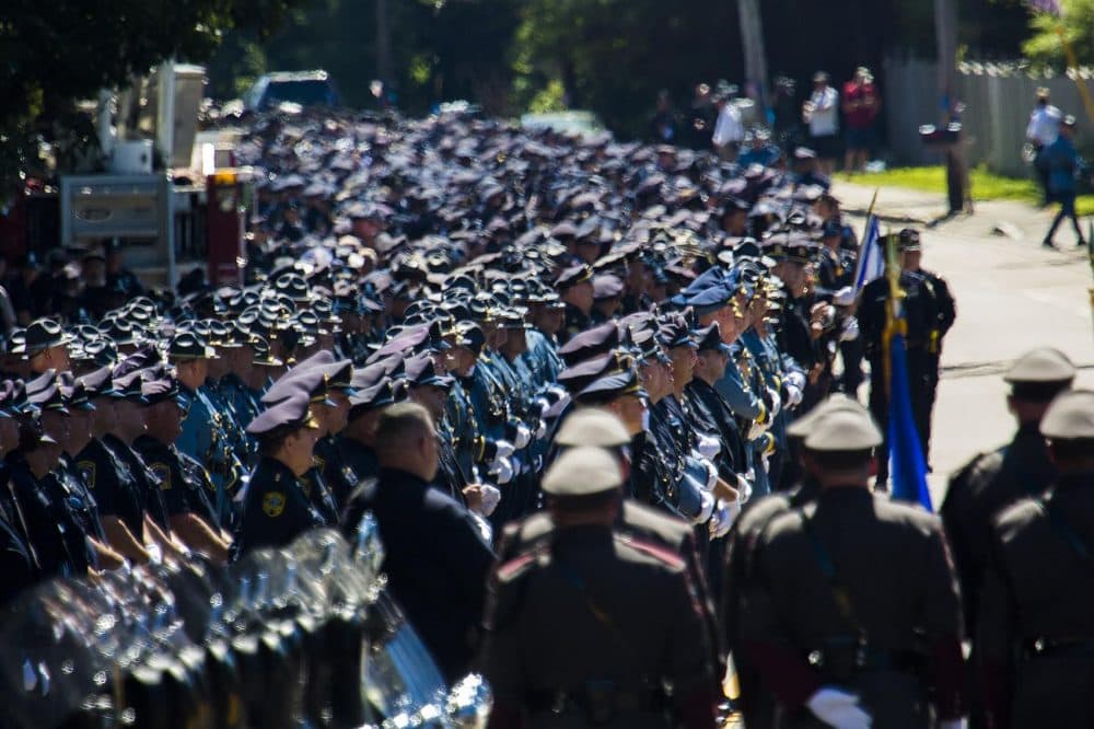 Thousands of police officers line up outside St. Mary's of the Sacred Heart Church in Hanover to pay their respect to Officer Michael Chesna. (Jesse Costa/WBUR)