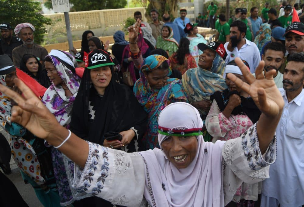 Supporters of chairman of Pakistan Peoples Party (PPP) Bilawal Bhutto dance as they gather during an election campaign rally In Karachi on July 20, 2018. (Asif Hassan/AFP/Getty Images)