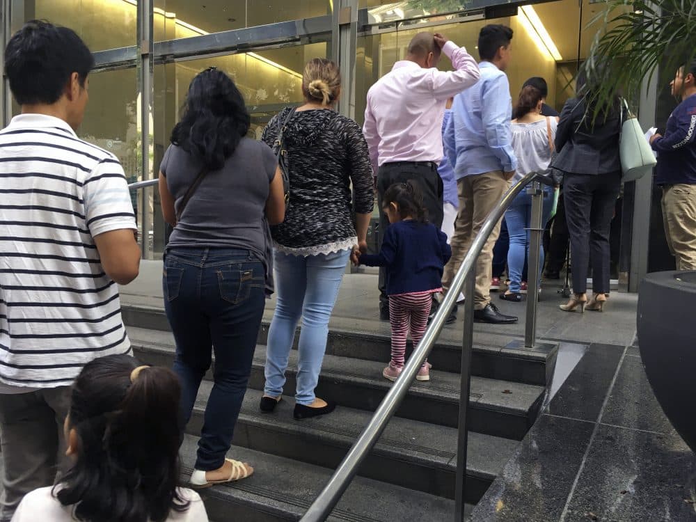 In this June 28, 2018, photo, people line up outside the building that houses the immigration courts in Los Angeles. In recent weeks, immigration judges have been thrust into the center of the heated political controversy over how the Trump administration is handling the cases of mostly Central American immigrants caught on southwest border. (Amy Taxin/AP)