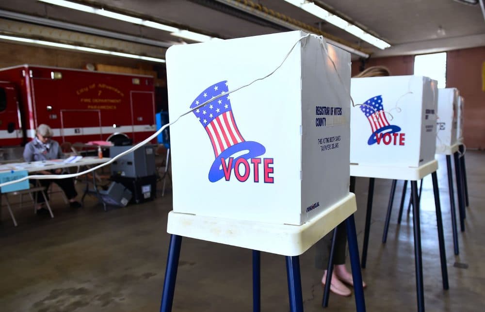 A woman casts her vote at a polling station inside the Alhambra Fire Department in Alhambra, Calif., on June 5, 2018 as Californians go to the polls to vote in primary elections. (Frederic J. Brown/AFP/Getty Images)