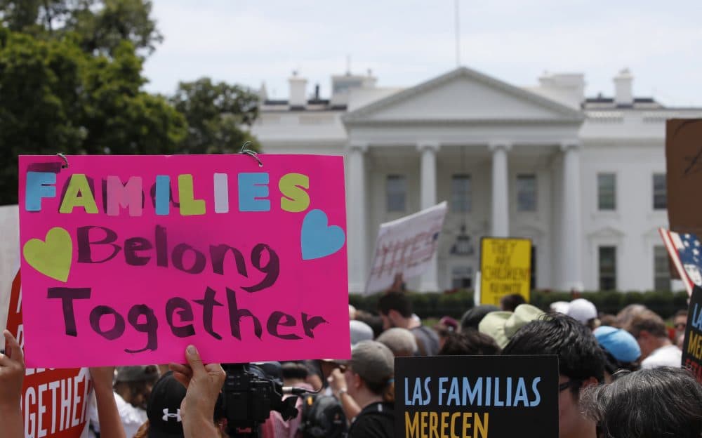 In this June 20, 2018, file photo, activists march past the White House to protest the Trump administration's approach to illegal border crossings and separation of children from immigrant parents in Washington. (Alex Brandon/AP)