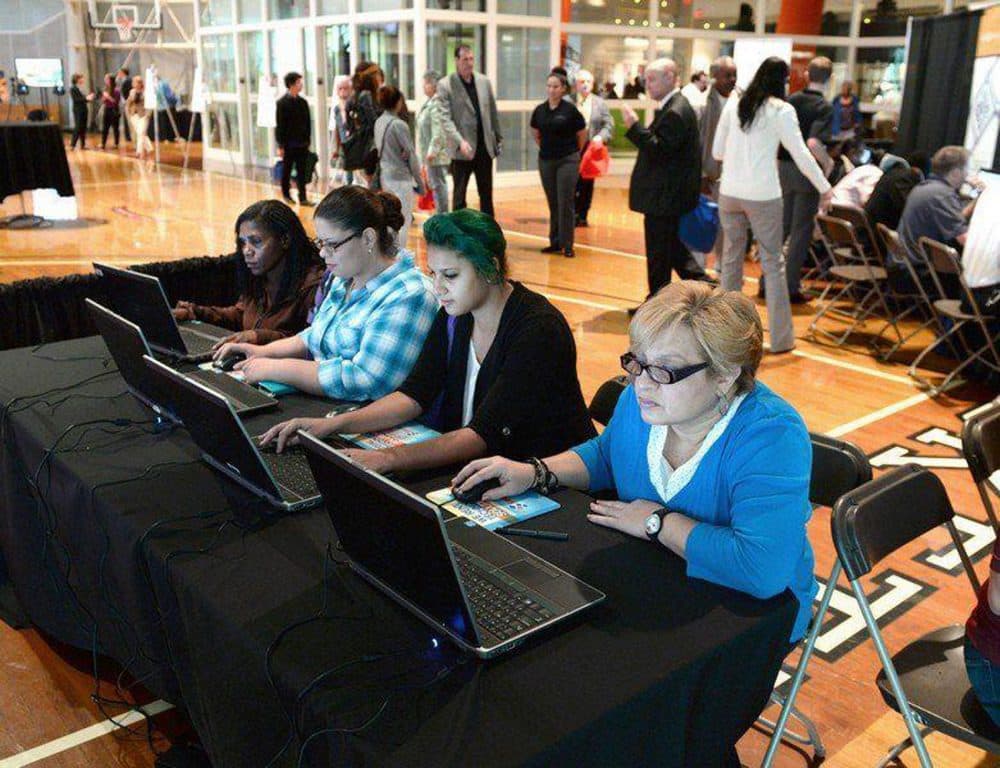 People looking to get a job at MGM Springfield use the computer to match their skills to potential jobs, during a career fair in October 2014. (Mark M. Murray/The Republican/MassLive.com)