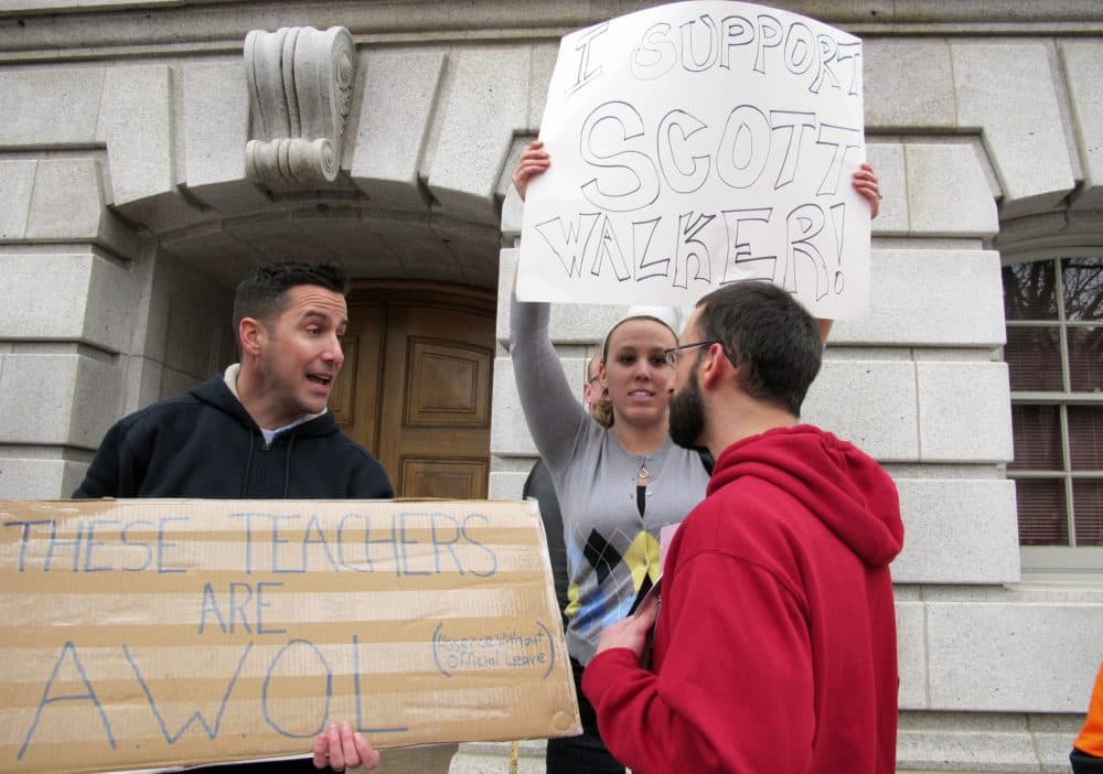 Protesters in Madison, Wisconsin, gather to support Gov. Scott Walker's &quot;Act 10&quot; bill in 2011. (Dinesh Ramde/AP)