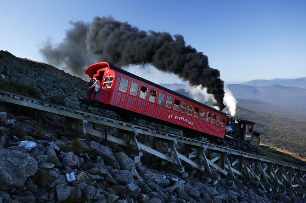A vintage steam engine pushes a passenger car up the Cog Railway on a 3.8-mile journey to the summit of 6,288-foot Mount Washington in New Hampshire on Sept. 24, 2017. (Robert F. Bukaty/AP)