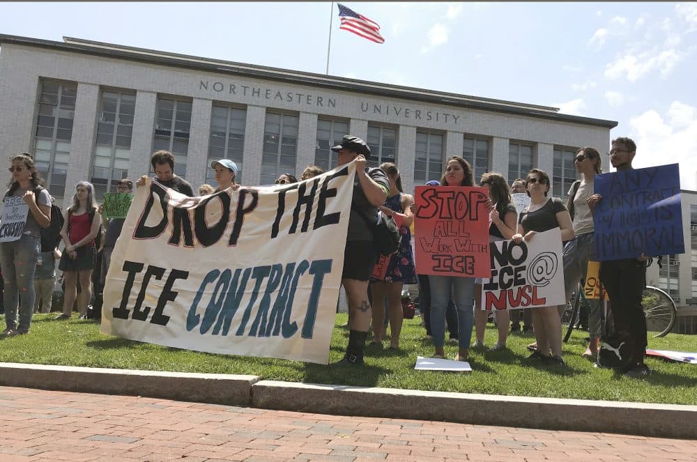 Students and community activists rally at Northeastern University, Wednesday, July 11, 2018, in Boston demanding the school cancel a multimillion-dollar research contract with U.S. Immigration and Customs Enforcement. Federal spending data show that Northeastern has received $2.7 million from ICE over the last two years. Northeastern said the grant isn't funding research that has anything to do with immigration enforcement. (Sarah Betancourt/AP)