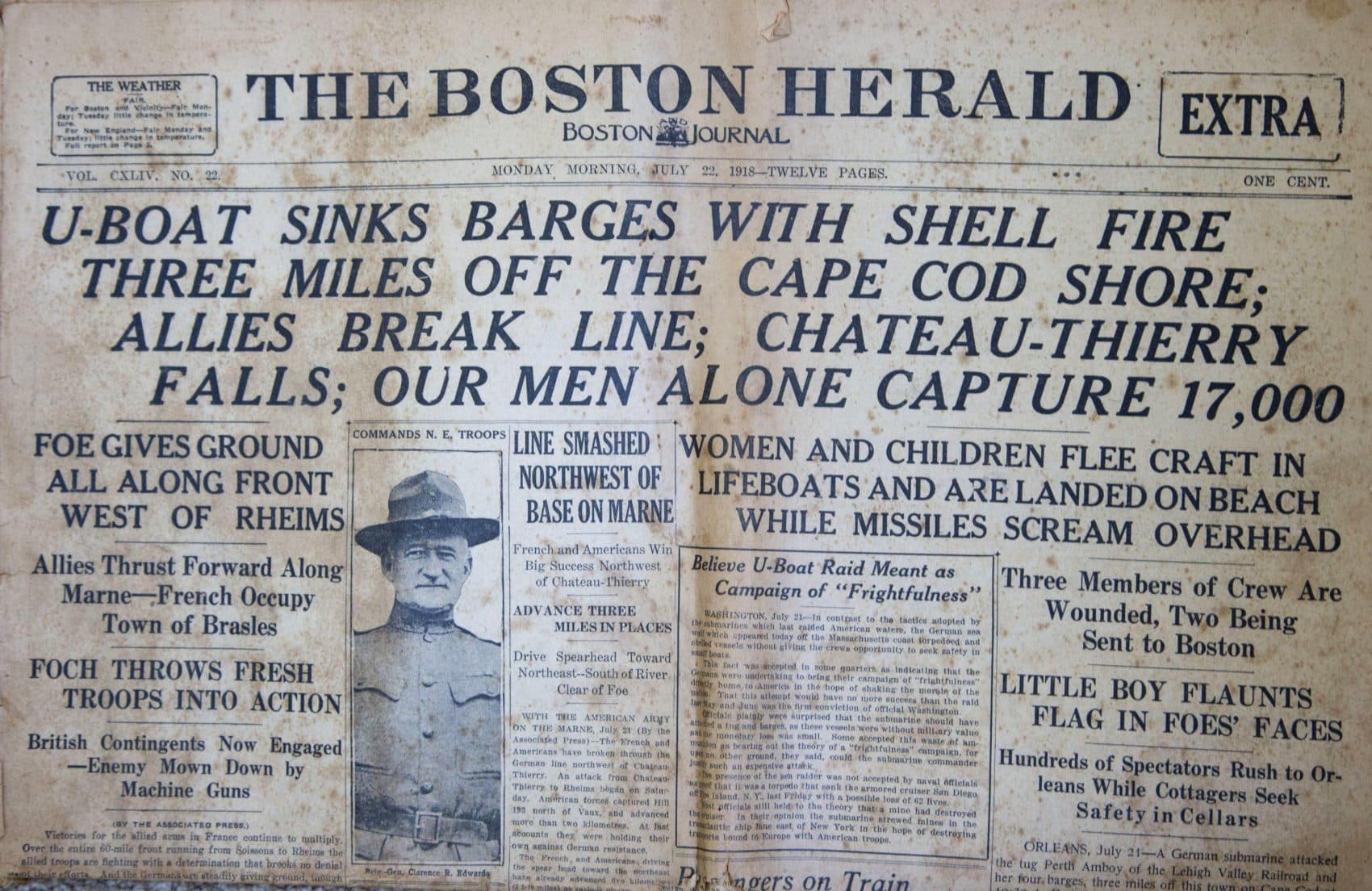 This image shows the front page of the July 22, 1918, edition of The Boston Herald, from the Walter Howard Mayo III collection, headlining a report of a German World War I submarine attack on Orleans, Mass., which took place the day before. Orleans was the only town on U.S. soil to receive enemy gunfire during World War I. (Boston Herald via AP)