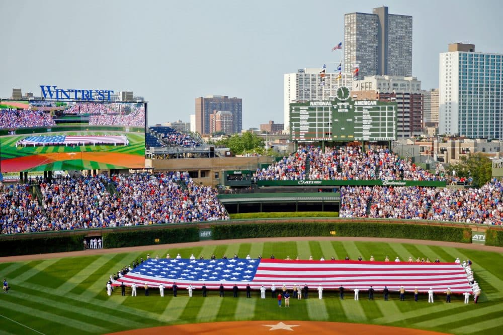 Before 9/11, giant flags and flyovers weren't commonplace at sporting events. (Jon Durr/Getty Images)