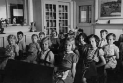 Titia Bozuwa, second from the left in the first row, pictured as a girl in a 1941 photo at her school in Breda, Holland. Her classmate, Carrie Goldstein, is the third girl from the right in the second row. Goldstein was murdered by the Nazis at Auschwitz. (Courtesy of Titia Bozuwa)