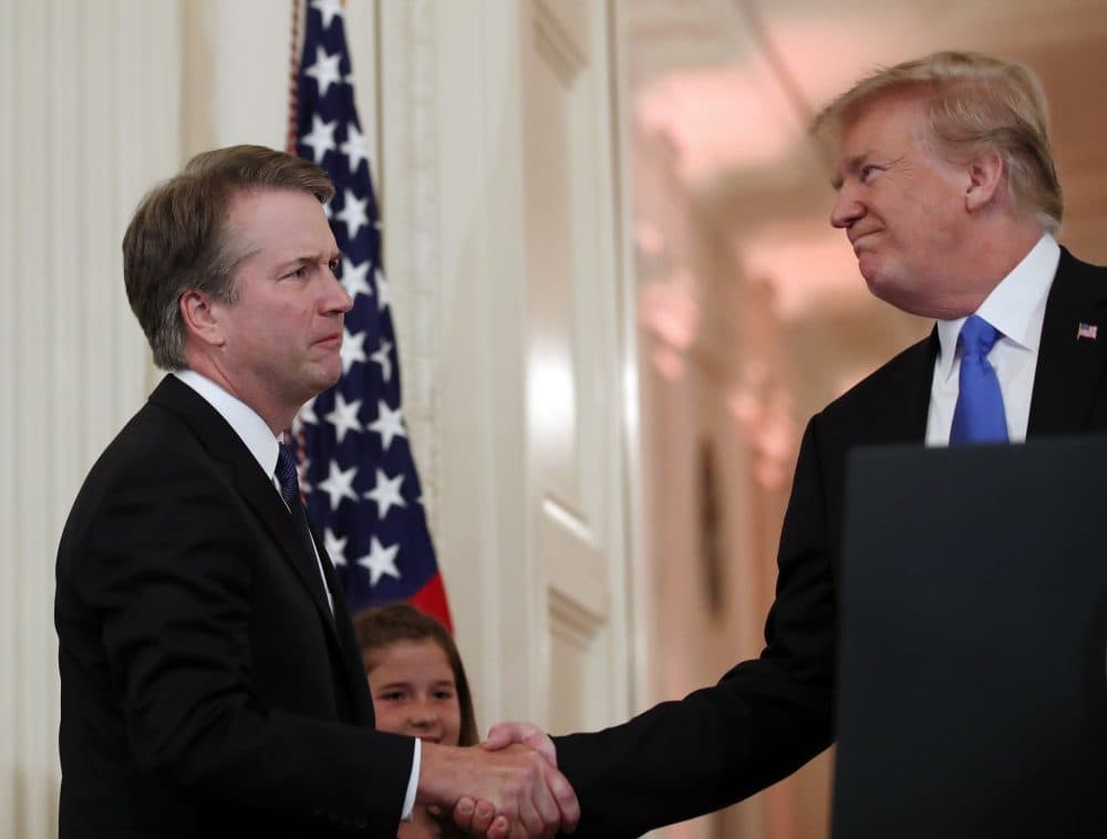 President Trump shakes hands with Judge Brett Kavanaugh his Supreme Court nominee, in the East Room of the White House on Monday. (Alex Brandon/AP)