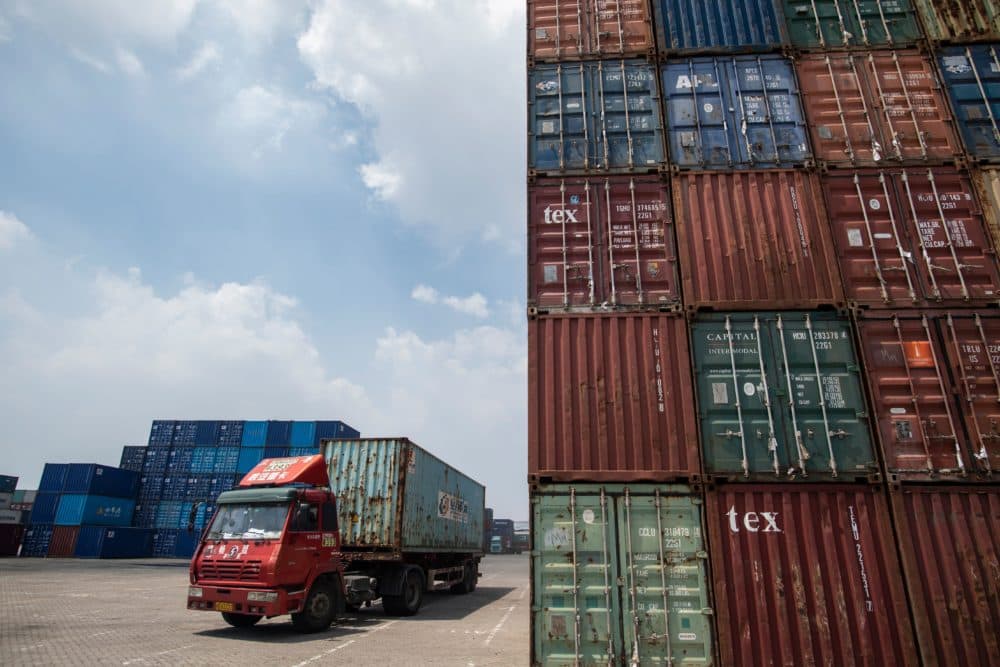 This photo taken on Aug. 7, 2018 shows a truck transporting a container next to stacked containers at a port in Zhangjiagang in China's eastern Jiangsu province. China's trade surplus with the United States eased in July, when President Trump imposed stiff tariffs on billions of dollars worth of Chinese goods in a showdown between the world's two biggest economies. (Johannes Eisele/AFP/Getty Images)