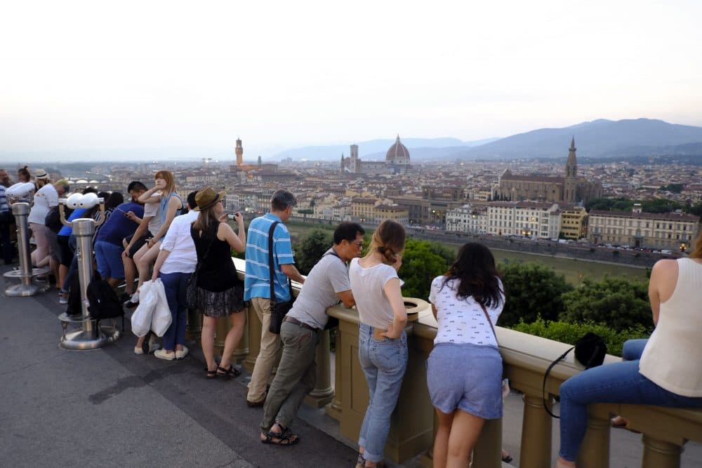 Tourists in Florence enjoy the view from Piazzale Michelangelo on May 26, 2018 at sunset. (Andreas Solaro/AFP/Getty Images)