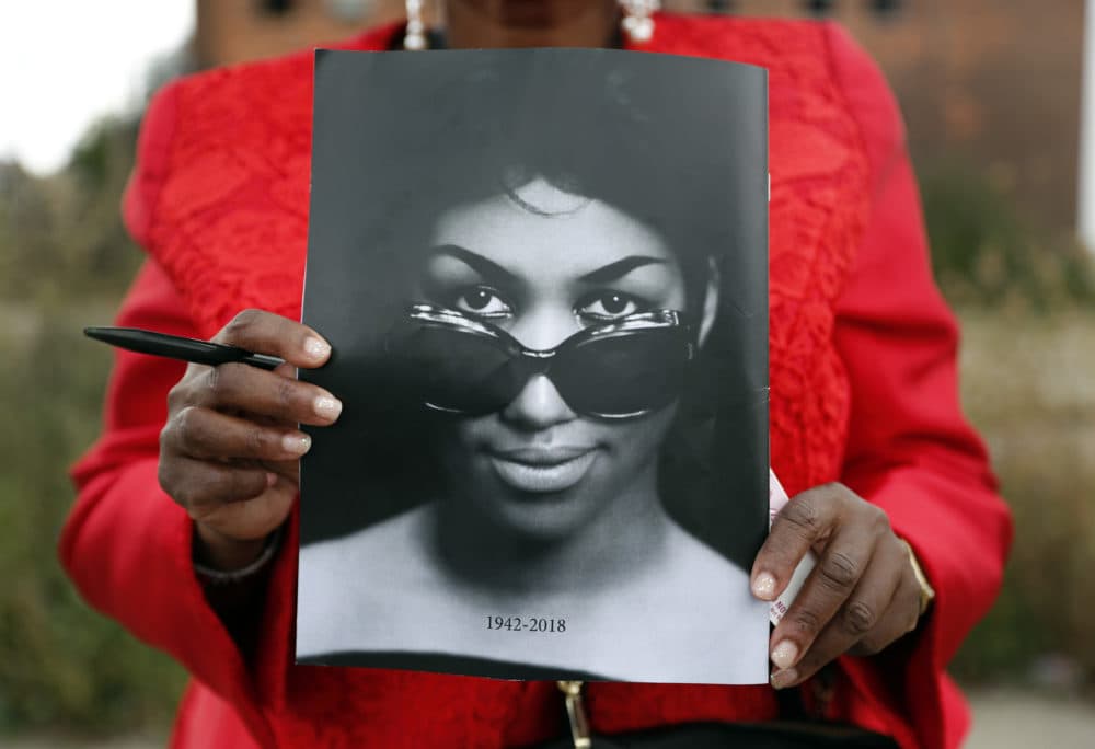 Sharon Napoleon holds a program as she stands outside a viewing for legendary singer Aretha Franklin at New Bethel Baptist Church Thursday, Aug. 30, 2018, in Detroit. Franklin died Aug. 16, 2018 of pancreatic cancer at the age of 76. (Jeff Roberson/AP)