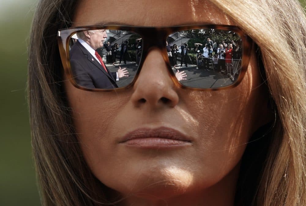 President Donald Trump's reflections are seen in the first lady Melania Trump's sunglasses as the president stops to answers questions on at South Lawn of the White House in Washington, Sunday, Sept. 10, 2017. (Pablo Martinez Monsivais/AP)