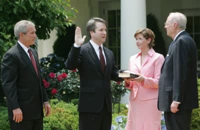  In this June 1, 2006 file photo, from left to right, President Bush, watches the swearing-in of Brett Kavanaugh as Judge for the U.S. Court of Appeals for the District of Columbia by U.S. Supreme Court Associate Justice Anthony M. Kennedy, far right, during a ceremony in the Rose Garden of the White House, in Washington. (Pablo Martinez Monsivais/AP)
