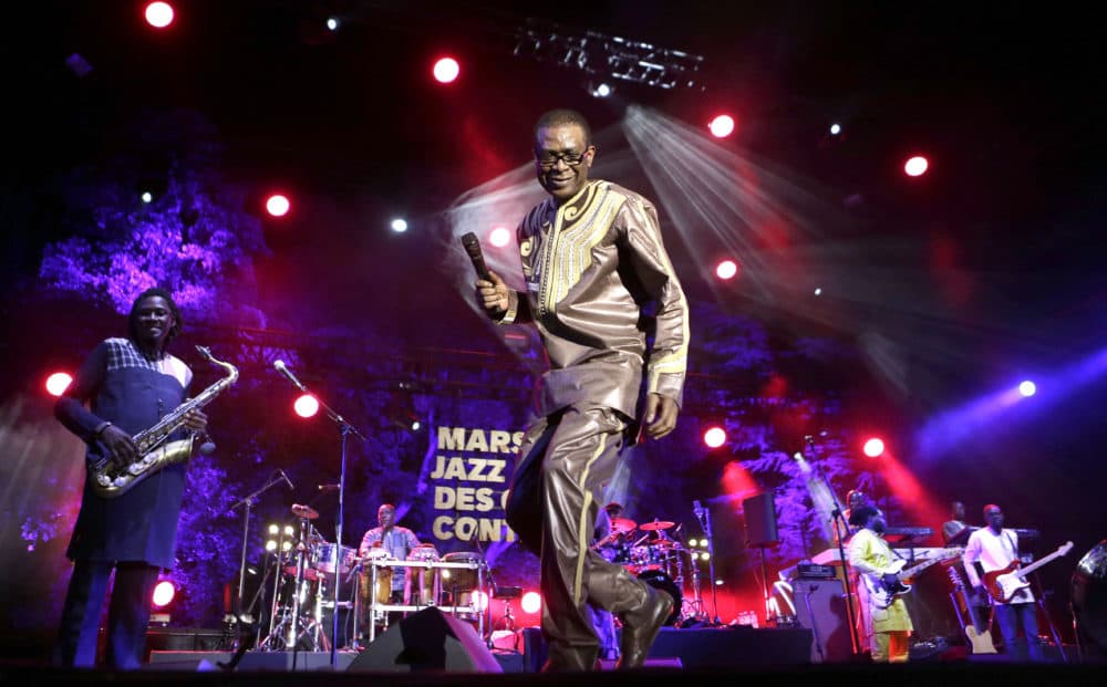 Senegalese singer Youssou N'Dour performs with the Super Star of Dakar group at the Five Continents Marseille Jazz festival, in Marseille, southern France, Wednesday, July 25, 2018. (Claude Paris/AP)