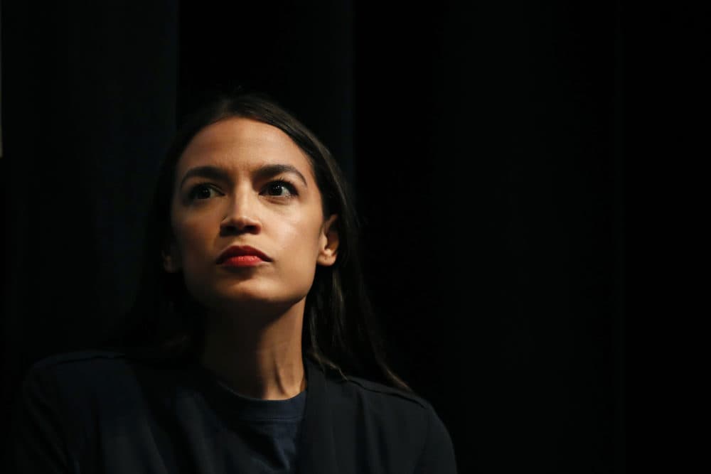 New York congressional candidate Alexandria Ocasio-Cortez listens to a speaker at a fundraiser Thursday, Aug. 2, 2018, in Los Angeles. The 28-year-old startled the party when she defeated 10-term U.S. Rep. Joe Crowley in a New York City Democratic primary. Ocasio-Cortez is a rising liberal star who is challenging the Democratic Party establishment. (Jae C. Hong/AP)