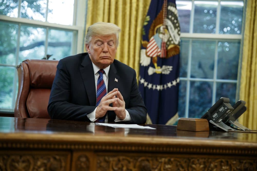 President Donald Trump listens during a phone call with Mexican President Enrique Pena Nieto about a trade agreement between the United States and Mexico, in the Oval Office of the White House, Monday, Aug. 27, 2018, in Washington. (Evan Vucci/AP)