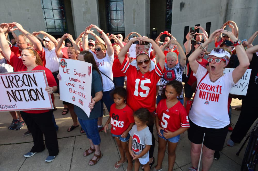 Supporters of Ohio State head football coach Urban Meyer sing Carmen Ohio at an August 6th rally in Columbus, Ohio. (Jamie Sabau/Getty Images)
