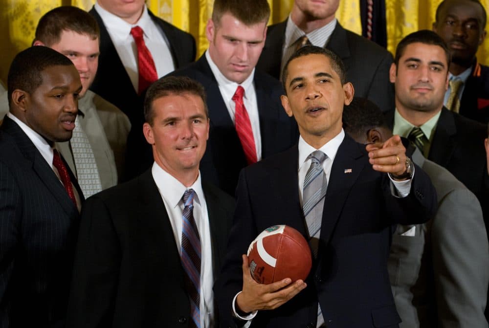 Urban Meyer, now Ohio State's head football coach, stands alongside Barack Obama during a ceremony honoring the NCAA champion Florida Gators in 2009. (Saul Loeb/AFP/Getty Images)