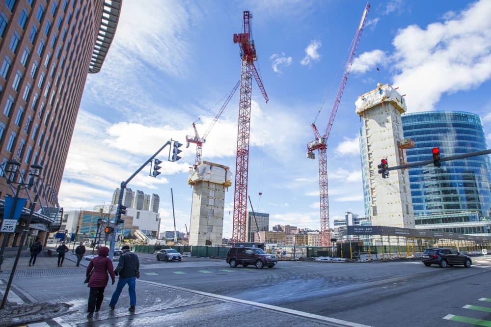 Cranes stretch into the sky over what will become three-buildings of luxury apartments and condominiums, the EchelonSeaport. (Jesse Costa/WBUR)