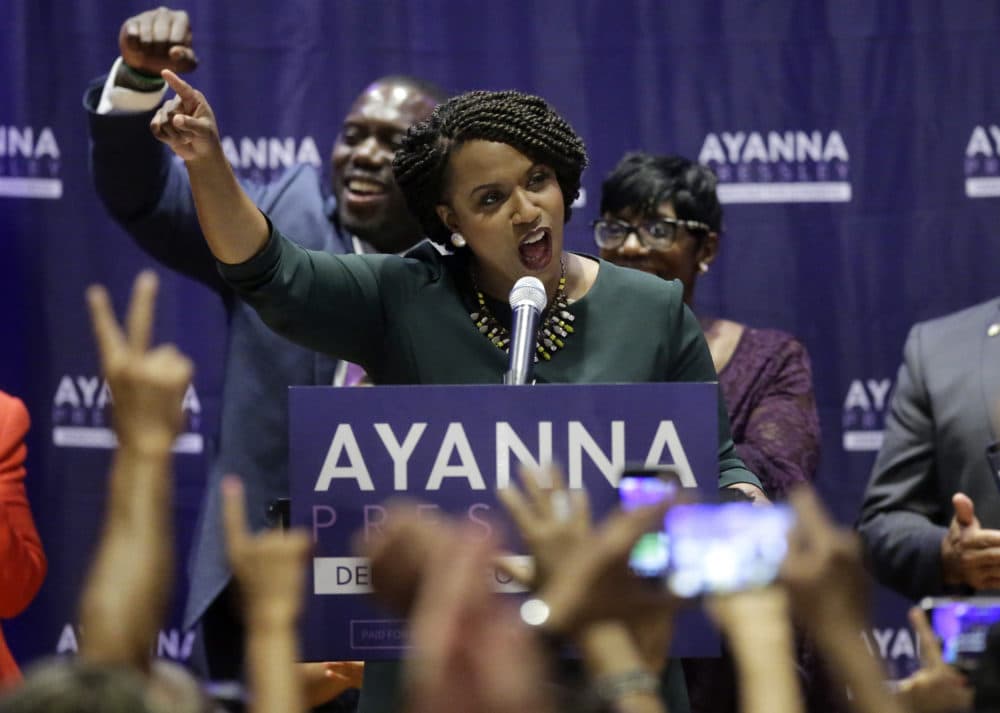 Boston City Councilor Ayanna Pressley, center, celebrates victory over U.S. Rep. Michael Capuano, D-Mass., in the 7th Congressional House Democratic primary on Tuesday. (Steven Senne/AP)