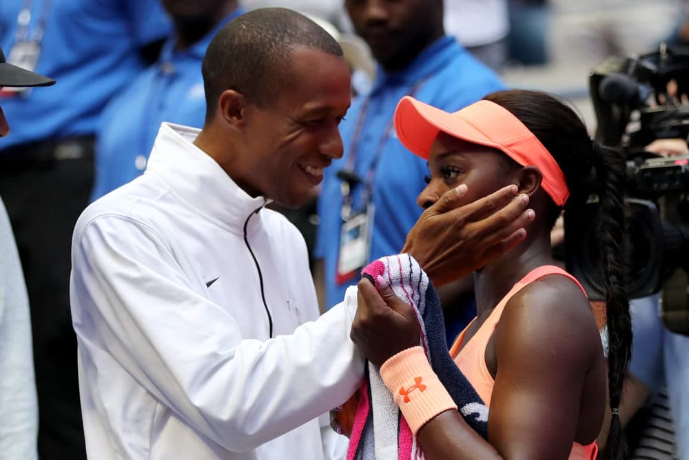 Kamau Murray (left) coaches Sloane Stephens — but that's not his only job. (Elsa/Getty Images)