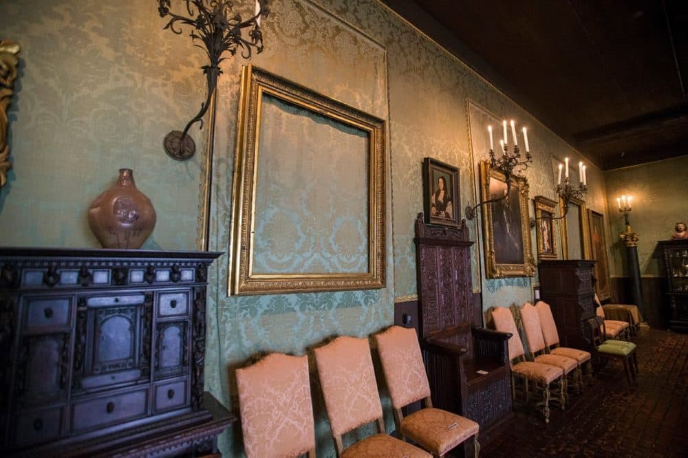 The back wall of the Dutch Room where the empty frames of two Rembrandt paintings hang; &quot;Lady and Gentleman in Black,&quot; front, and &quot;Christ in the Storm on the Sea of Galilee.&quot; (Jesse Costa/WBUR)