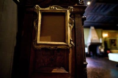 The empty frame of Rembrandt's &quot;Self Portrait&quot; Etching in the Dutch Room at the Isabella Stewart Gardner Museum. (Jesse Costa/WBUR)