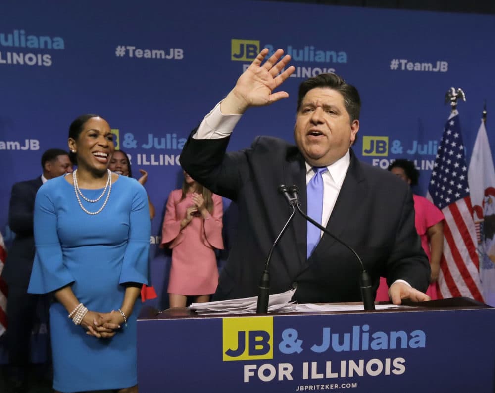 Democratic gubernatorial candidate J.B. Pritzker, right, celebrates winning the Democratic gubernatorial primary with lieutenant governor candidate Juliana Stratton, Tuesday, March 20, 2018, in Chicago. (Charles Rex Arbogast/AP)