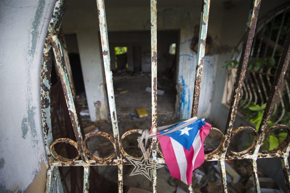 An abandoned house in Barrio-Bravos De Boston in Cantera, San Juan, left by the owners due to the prolonged wait to restore electricity in the area after Hurricane Maria. The house was then possessed by drug users for a time before local residents drove them out and now has plans to clean it up. (Jesse Costa/WBUR)