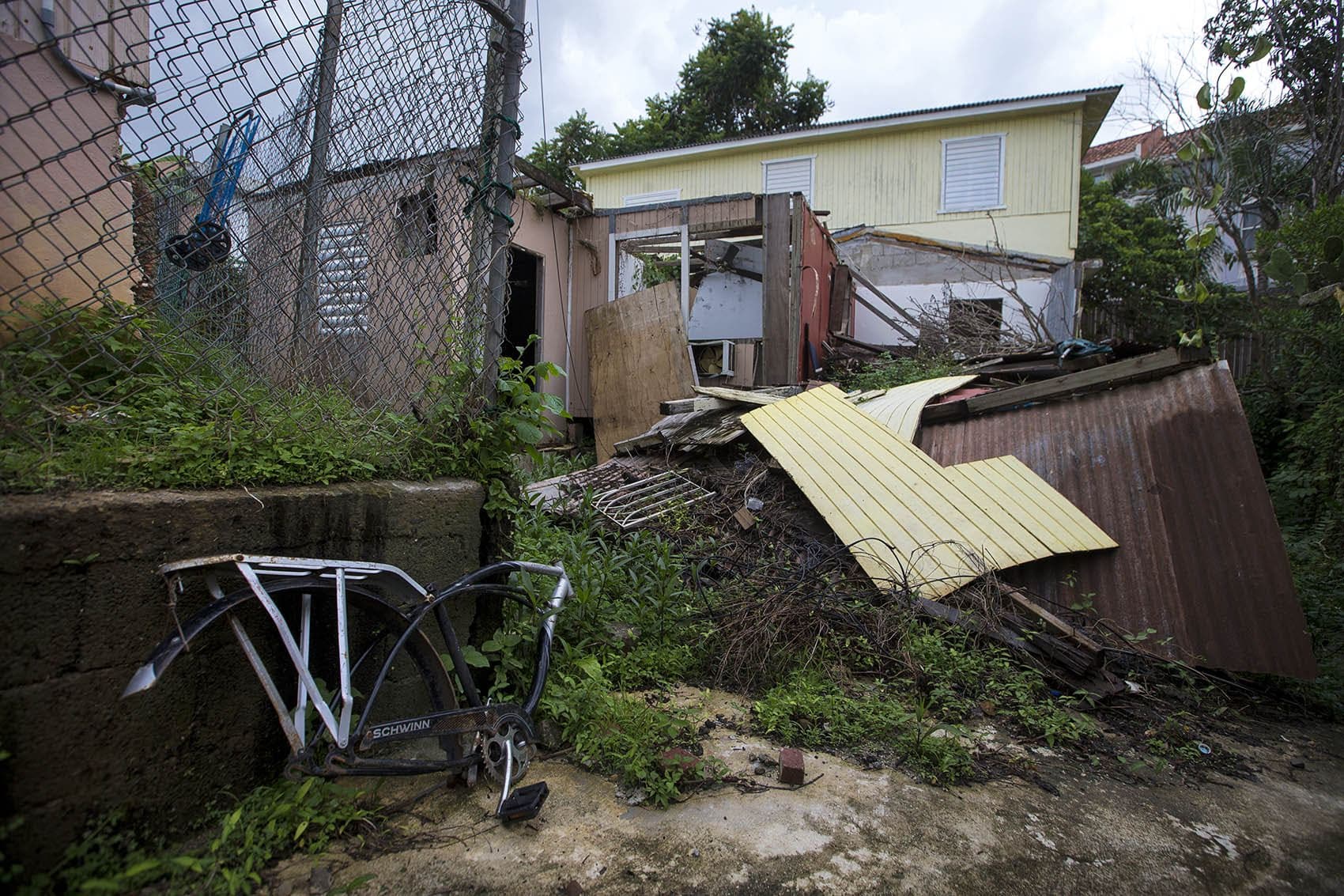 A house in Guaynabo, which was completely leveled by Hurricane Maria, still sits in ruin one year after the storm. (Jesse Costa/WBUR)