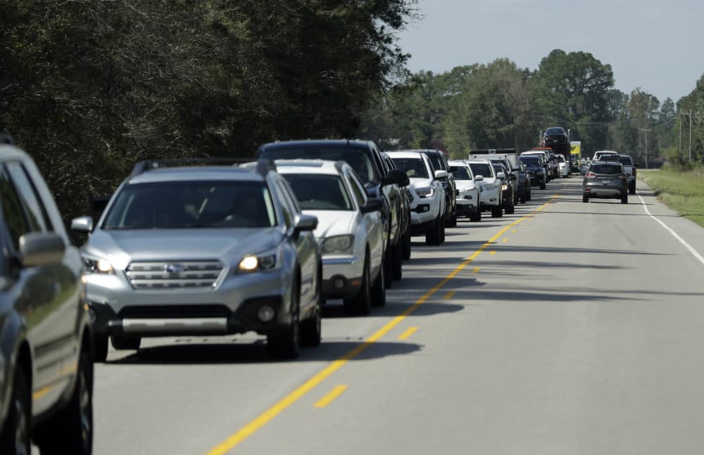 People sit in a long line of bumper-to-bumper traffic on US 421 in Harrells, N.C., Wednesday, Sept. 19, 2018 as they try to make their way toward Wilmington, N.C. (Chuck Burton/AP)