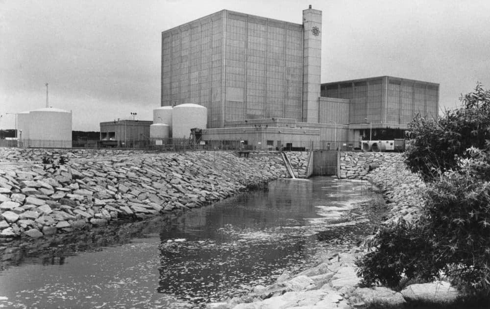 This July 12, 1979 photo shows the Pilgrim nuclear power plant in Plymouth, Massachusetts. Federal regulators are reviewing plans by the owner of the plant to sell the facility after it stops producing power next year. (AP Photo/Tannen Maury)