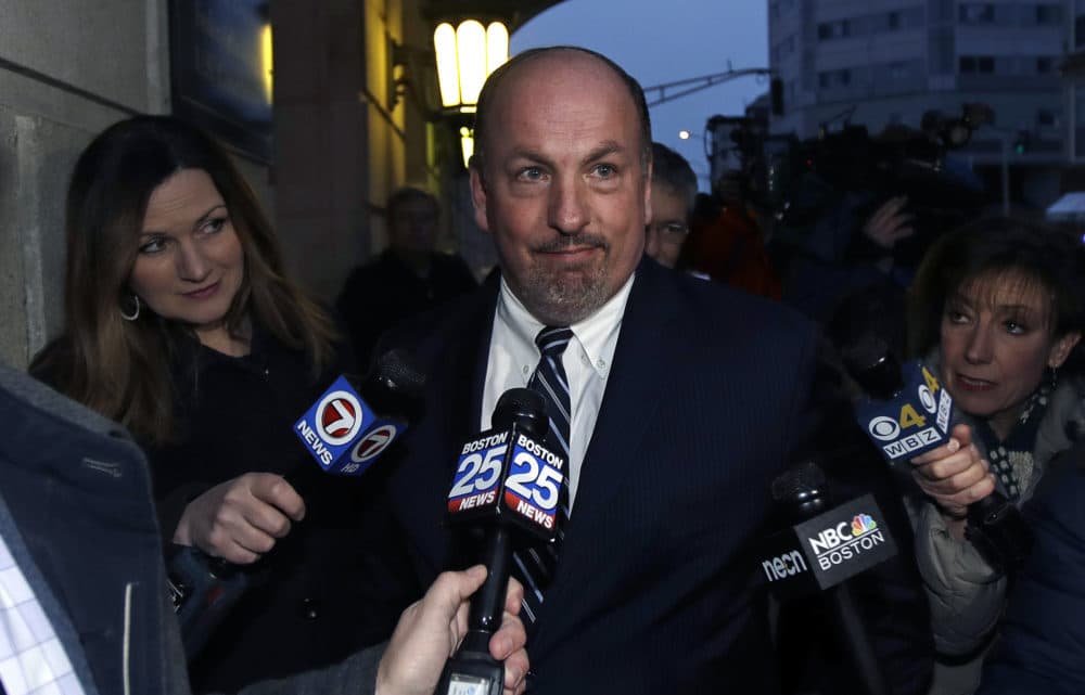 Former state Sen. Brian Joyce is surrounded by reporters as he leaves the federal courthouse in Worcester on Dec. 8, 2017. (Charles Krupa/AP)