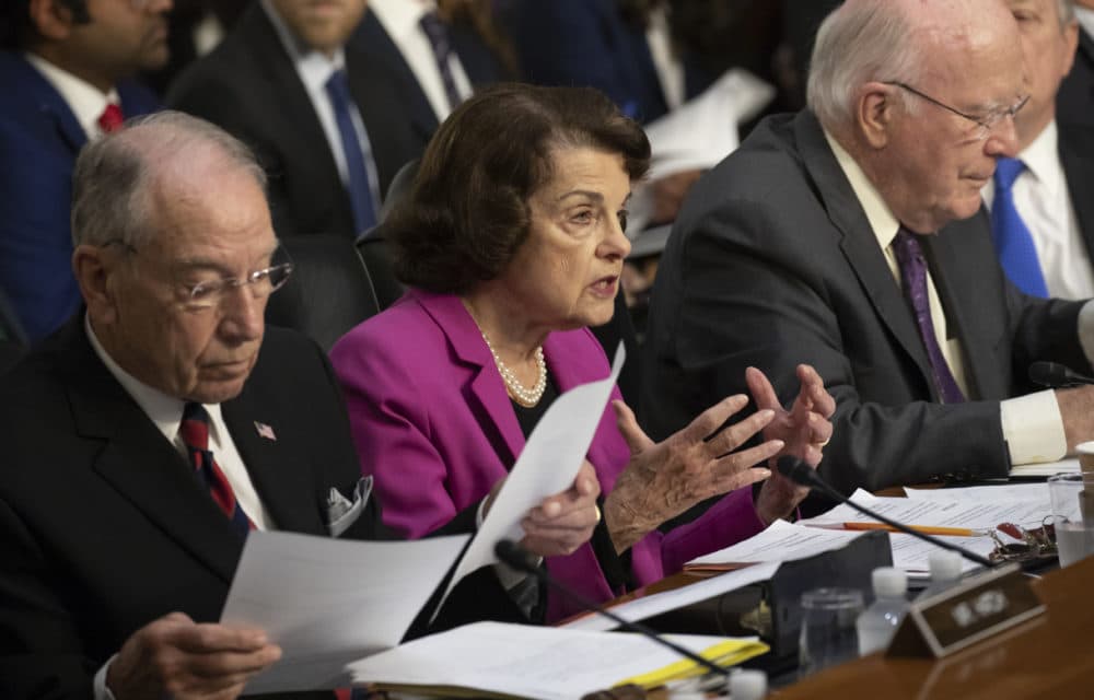 Sen. Dianne Feinstein, D-Calif., the ranking member on the Senate Judiciary Committee, flanked by Chairman Chuck Grassley, R-Iowa, left, and Sen. Patrick Leahy, D-Vt., right, makes an opening statement at the confirmation hearing of President Donald Trump's Supreme Court nominee, Brett Kavanaugh, on Capitol Hill in Washington, Tuesday, Sept. 4, 2018. (J. Scott Applewhite/AP)
