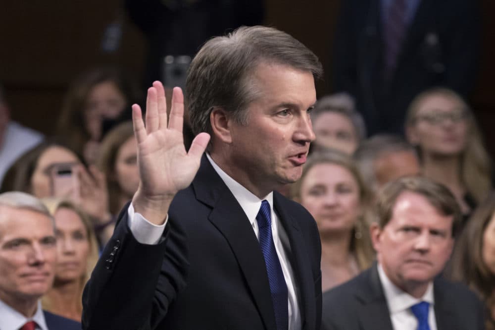 President Donald Trump's Supreme Court nominee, Brett Kavanaugh, raises his right hand as he is sworn in before the Senate Judiciary Committee for his confirmation hearing, on Capitol Hill in Washington, Tuesday, Sept. 4, 2018. (AP Photo/J. Scott Applewhite)