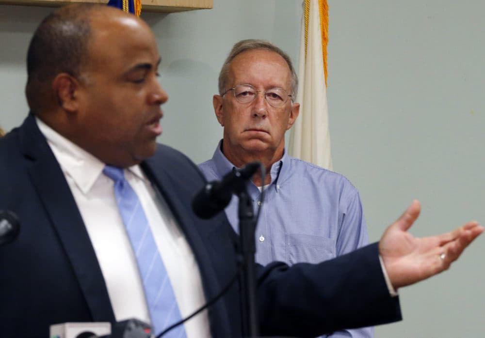 Columbia Gas of Massachusetts President Steve Bryant, right, listened to Lawrence Mayor Dan Rivera at a news conference in September 2018. Bryant will retire on May. 1. (Elise Amendola/AP)