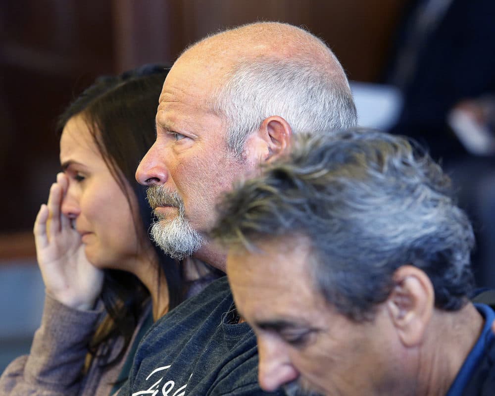 Family members of victim Shana Warner, from left, daughter Victoria Taylor, boyfriend John Tallent and father Tom DeFilippo, listen during the arraignment of her husband, Allen Warner, 47 in Plymouth District Court in Plymouth, Mass., on Wednesday, Sept.26, 2018. (Greg Derr/The Quincy Patriot Ledger via AP)