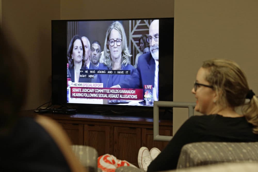 Students at the University of North Carolina School of Law in Chapel Hill, N.C. watch Christine Blasey Ford as she testifies before the Senate Judiciary Committee Thursday, Sept. 27, 2018. (AP Photo/Gerry Broome)
