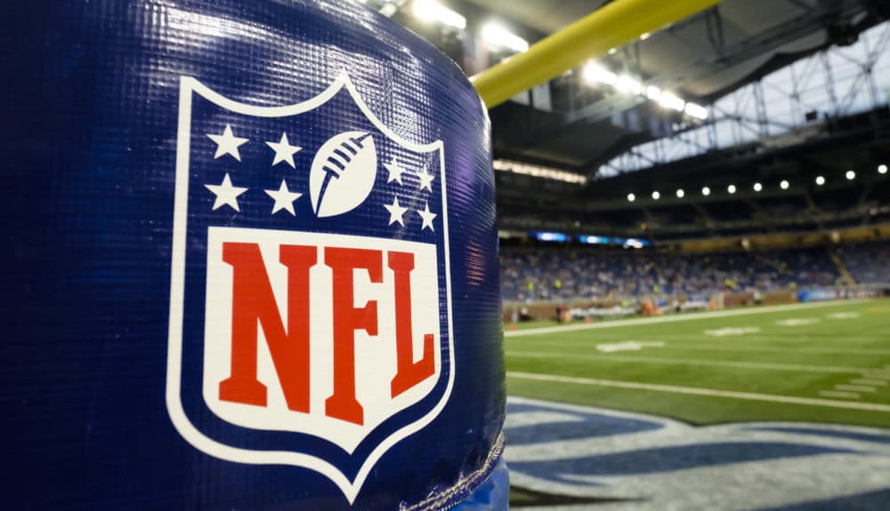 NFL Logo is seen on the goal post padding before an NFL preseason football game between the Detroit Lions and the New York Jets at Ford Field in Detroit, Thursday, Aug. 13, 2015. (AP Photo/Rick Osentoski)