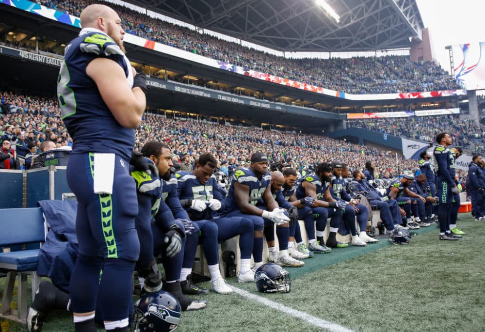 Members of the Seattle Seahawks sit for the national anthem before the game against the Los Angeles Rams on December 17, 2017. (Otto Greule Jr/Getty Images)