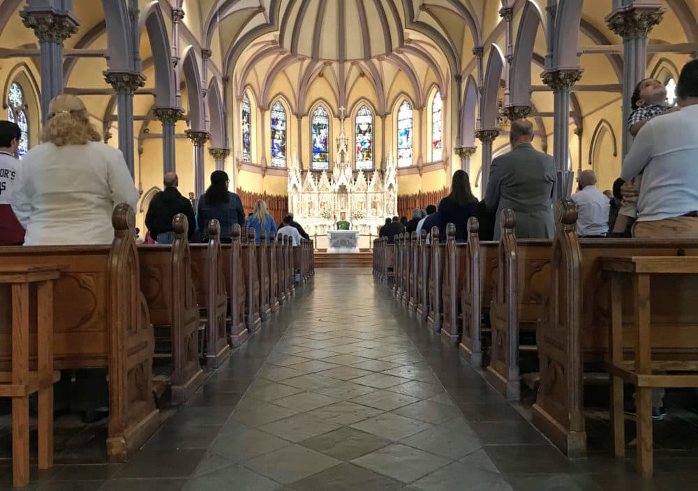 Rev. Paul O'Brien led mass at St. Patrick Parish in Lawrence Sept. 23. (Callum Borchers/WBUR)