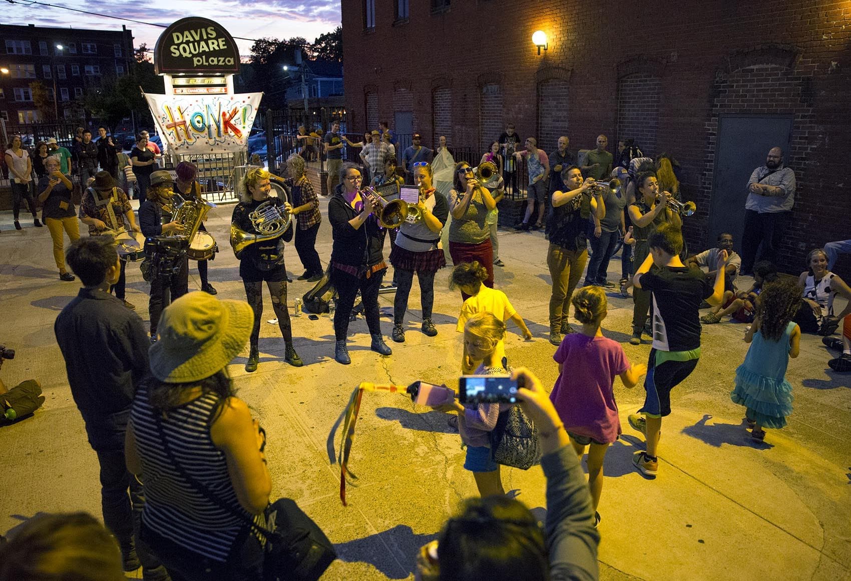 The Yes Ma'am Brass Band plays into the evening at HONK! in 2017. (Robin Lubbock/WBUR)