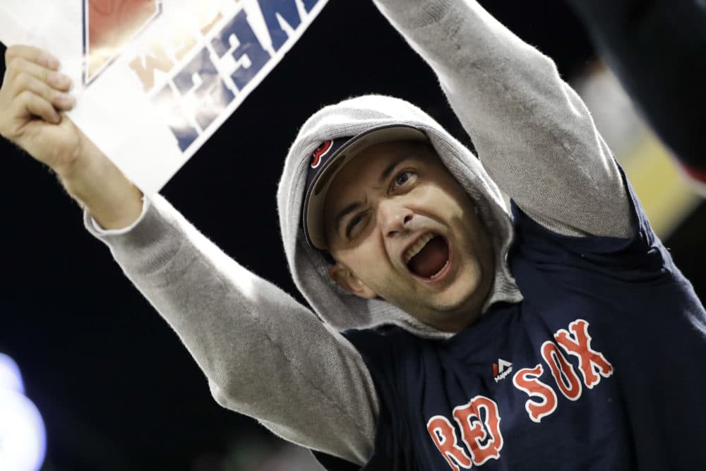 A Boston Red Sox fan cheers during the American League Championship Series against the Houston Astros in Boston. (David J. Phillip/AP)