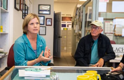 Georgia Ackerman (left), Apalachicola riverkeeper, from the nonprofit Waterkeeper Alliance, and Roy Ogles, who recently retired from the Florida Department of Environmental Protection. (Mark Wallheiser for Here & Now)